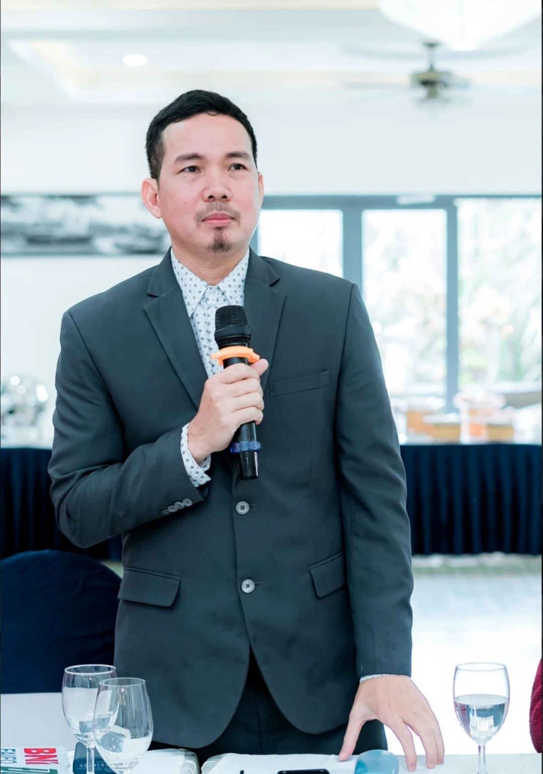 Tuan Abdullah speaking at a professional event